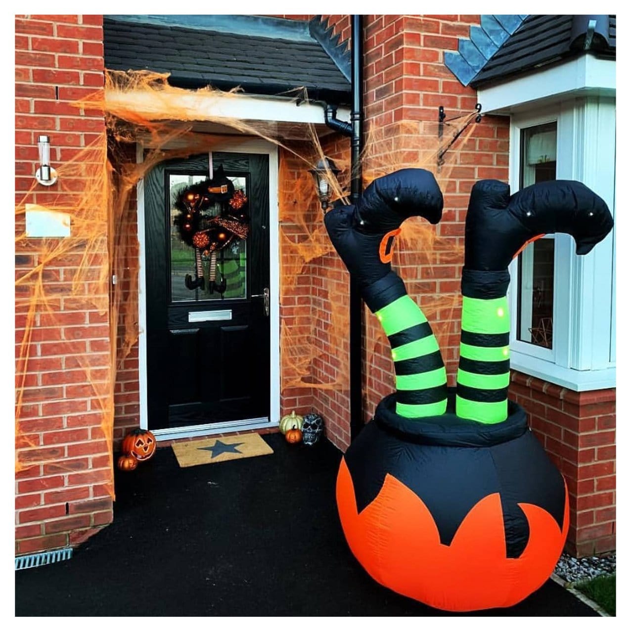 grab-your-favorite-giant-6ft-cauldron-and-witches-legs-light-up-inflatable-halloween-outdoor-decoration-on-sale_2.jpg