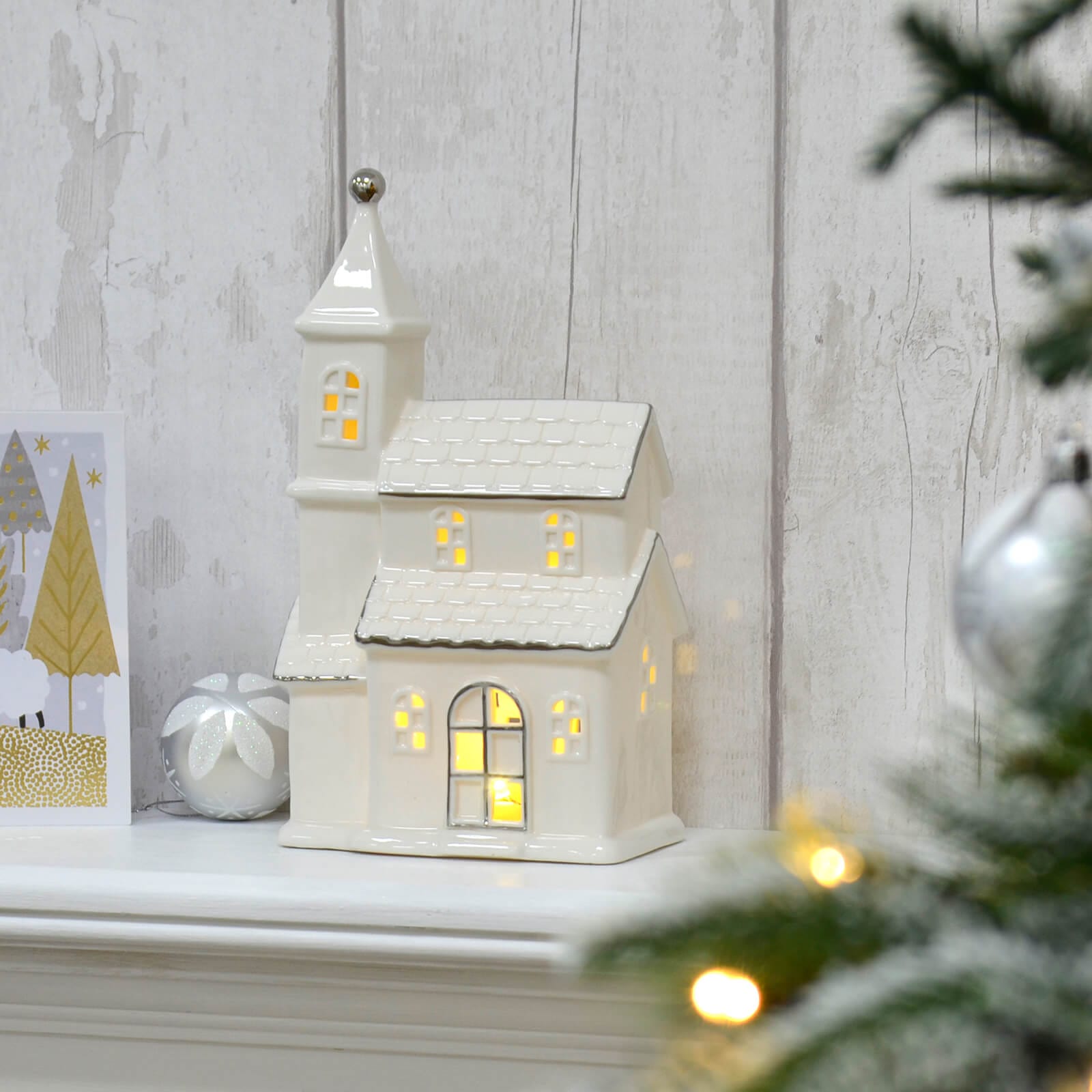 shop-our-official-led-town-house-christmas-decoration-silver-white-ceramic-25cm-discount_0.jpg